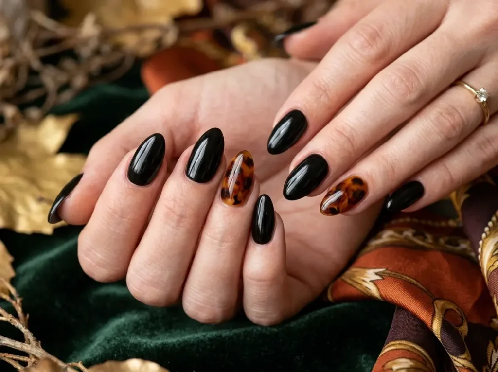 15 Classy Halloween Nails That Look Expensive (Short, Black & Almond) 8 Amber tortoiseshell Halloween nails paired with glossy black accent nails