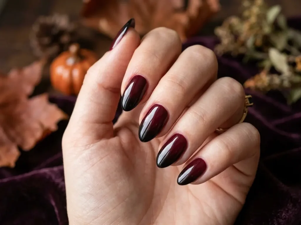 15 Classy Halloween Nails That Look Expensive (Short, Black & Almond) 6 Deep burgundy-to-black ombre Halloween nails on medium almond-shaped nails
