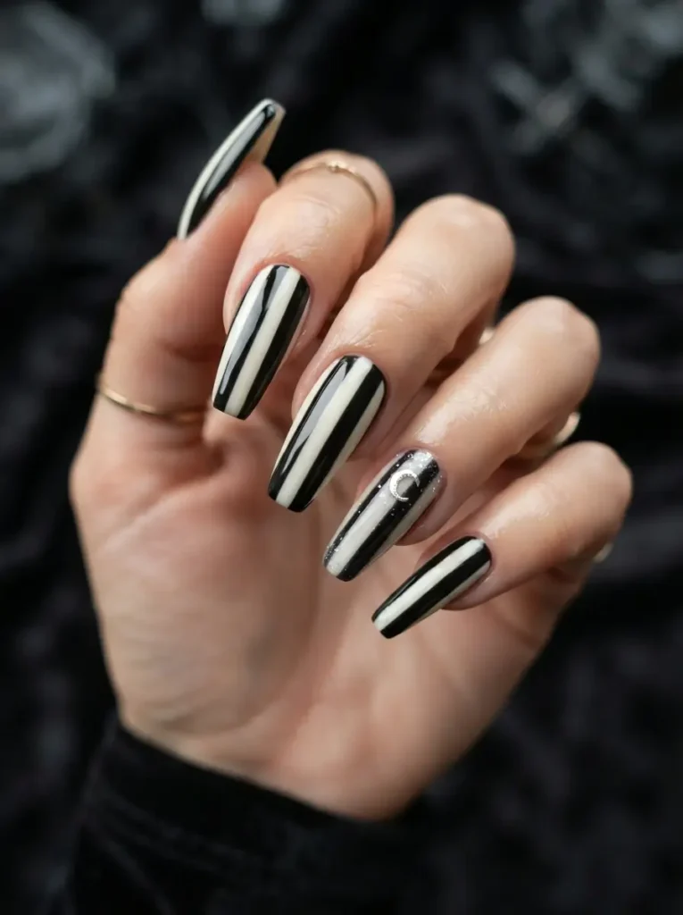 Halloween Nails 2026: 30+ Cute, Classy & Spooky Designs 26 black and white striped spooky Halloween nails